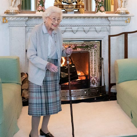 Queen Elizabeth II waits in the Drawing Room at Ba