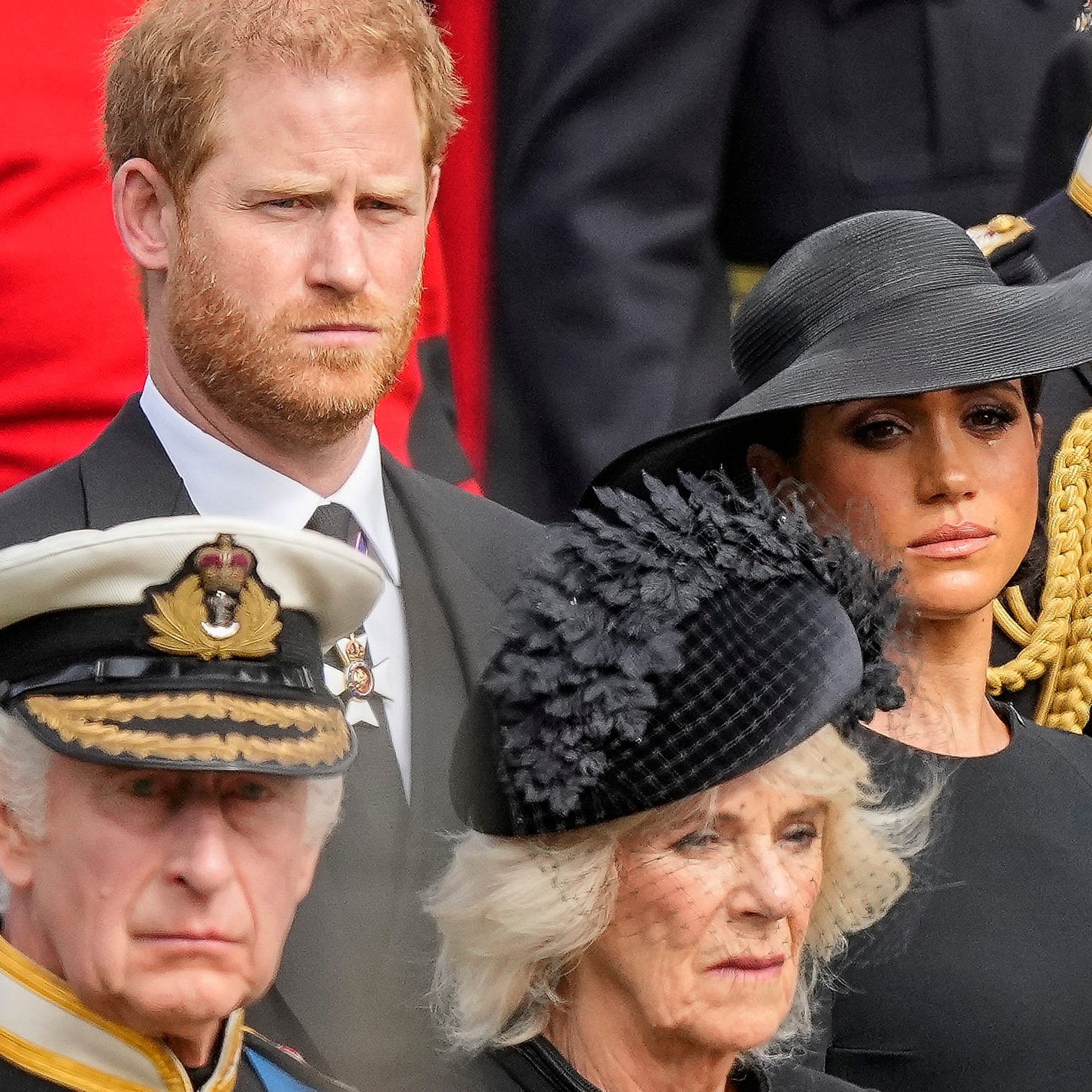 Britain's King Charles III, from bottom left, Camilla, the Queen Consort, Prince Harry and Meghan, Duchess of Sussex watch as the coffin of Queen Elizabeth II is placed into the hearse following the state funeral service in Westminster Abbey in central London Monday Sept. 19, 2022.