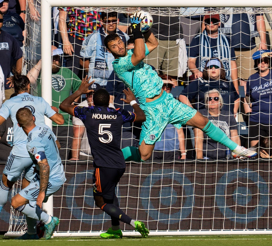 Oct. 2: Sporting Kansas City goalkeeper John Pulskamp makes a save against the Seattle Sounders' Nouhou Tolo (5) during the first half at Children's Mercy Park. Sporting KC won the game, 1-0.