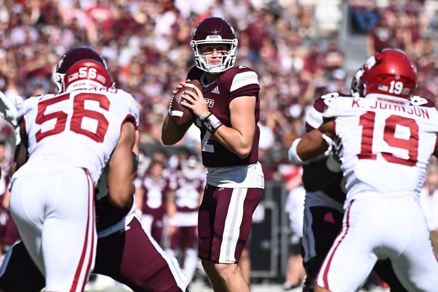 Mississippi State quarterback Will Rogers looks to pass against the Arkansas Razorbacks.