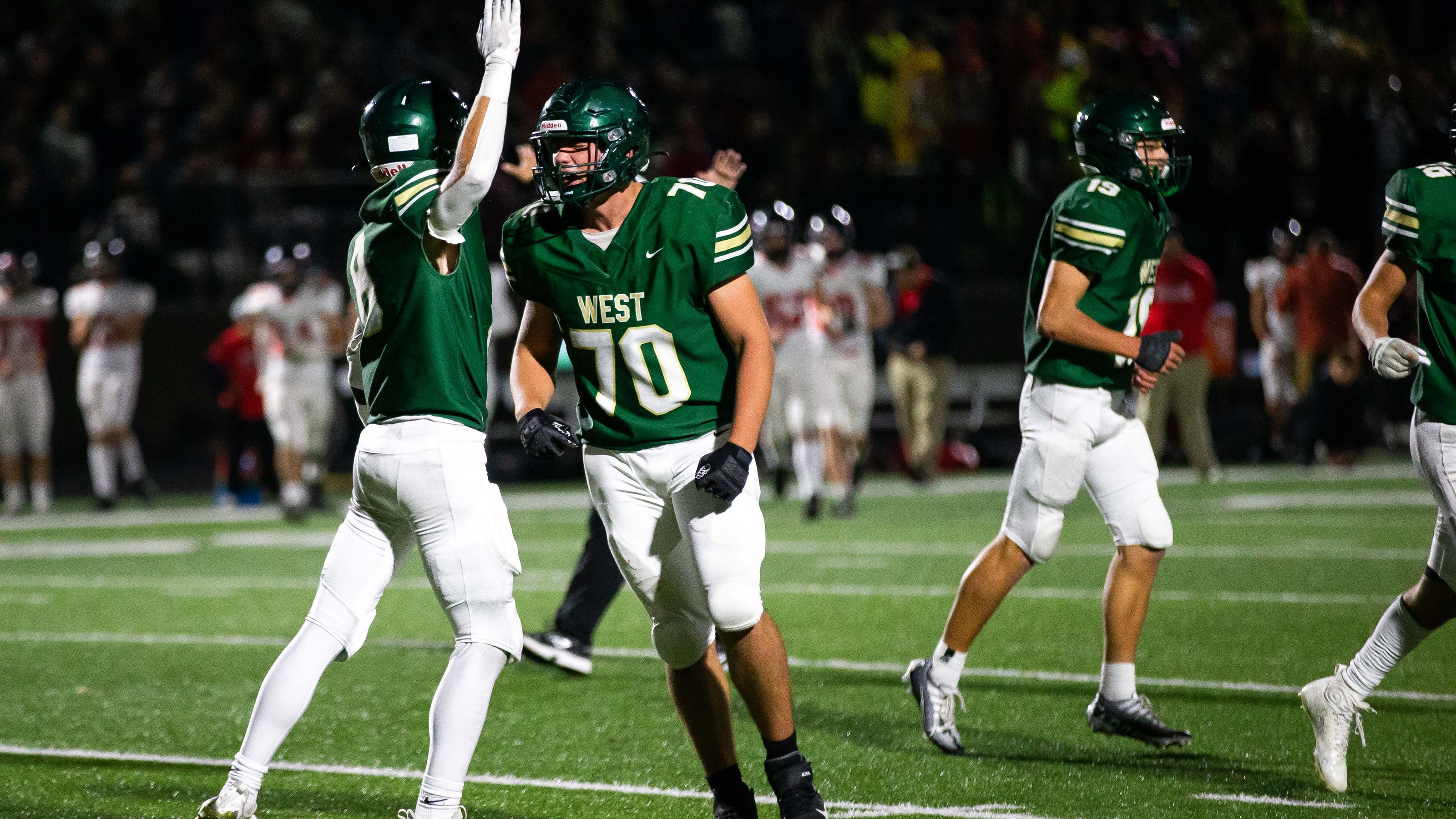 Zeeland West football hung on with late stop and score to beat Lowell