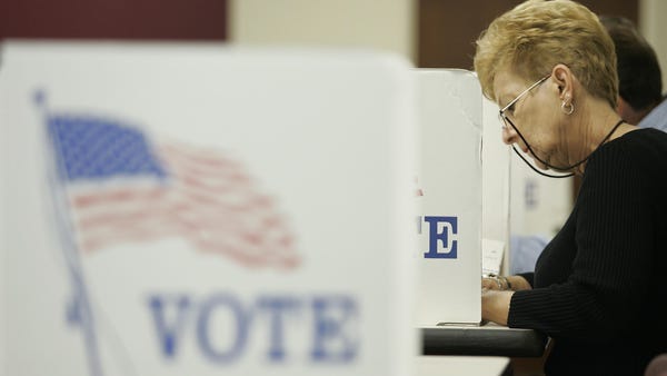 TOLEDO, OH - OCTOBER 1:  A woman looks over her pa