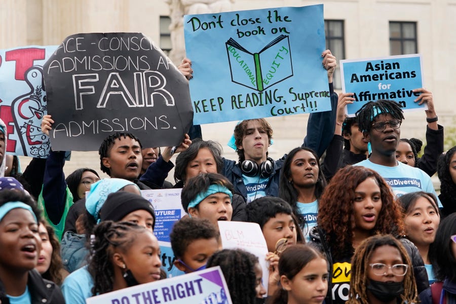 Protestors gather outside as the U.S. Supreme Courts hears oral arguments in two affirmative action college admission cases on October 31, 2022.