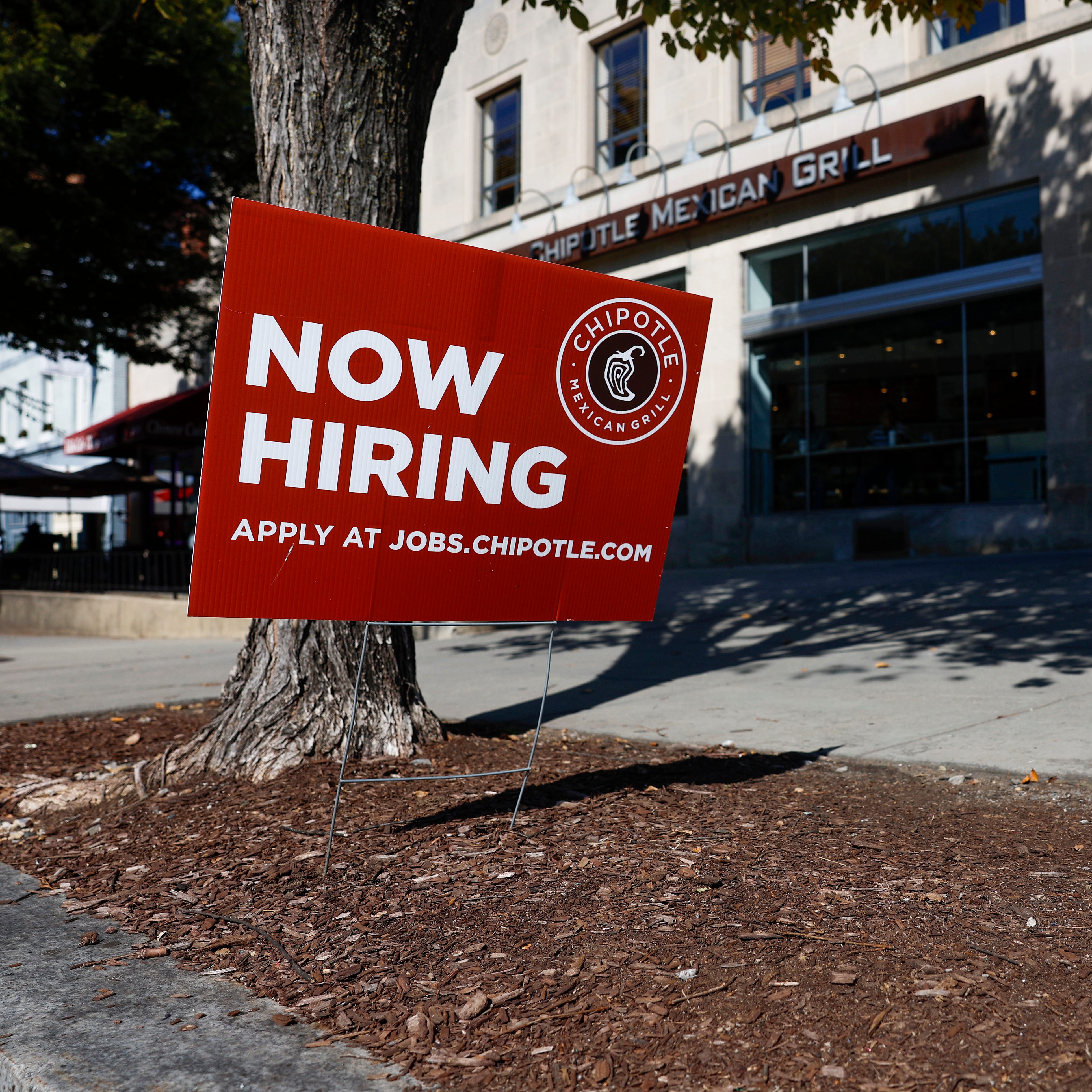 WASHINGTON, DC - OCTOBER 07: A "Now Hiring" sign is displayed in front of a Chipotle restaurant on October 07, 2022 in Washington, DC. The Labor Department announced that in the month of September the U.S. added 263,000 jobs as the unemployment rate fell to 3.5% (Photo by Anna Moneymaker/Getty Images) ORG XMIT: 775884553 ORIG FILE ID: 1431462807