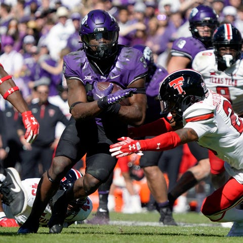 TCU running back Kendre Miller (33) carries the ba