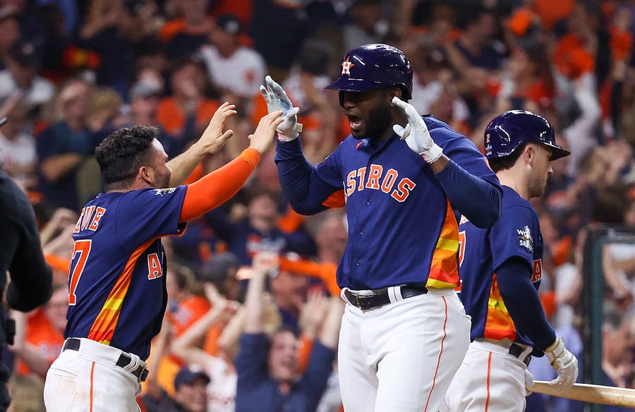 Game 6: Astros left fielder Yordan Alvarez celebrates with second baseman Jose Altuve.