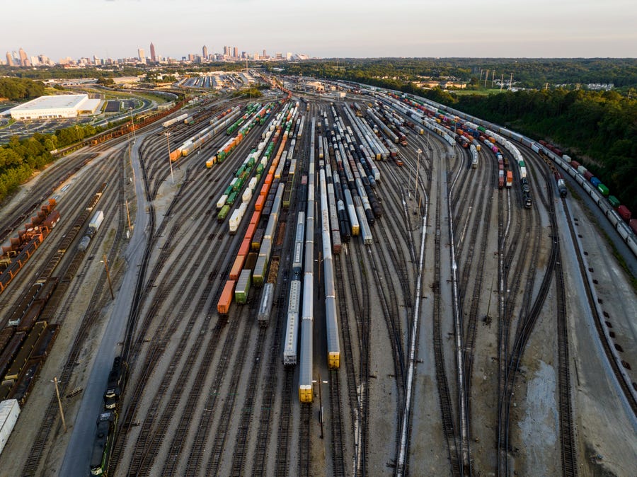 FILE - Freight train cars sit in a Norfolk Southern rail yard on Sept. 14, 2022, in Atlanta. Businesses are increasingly worried about the renewed threat of a railroad strike after two unions rejected their deals, and they want the White House and Congress to be ready to intervene. A coalition of 322 business groups sent a letter to President Joe Biden on Thursday, Oct. 27, 2022, urging him to make sure the deals he helped broker last month get approved because a railroad strike would have dire   consequences for the economy. (AP Photo/Danny Karnik, File) ORG XMIT: NYSS412