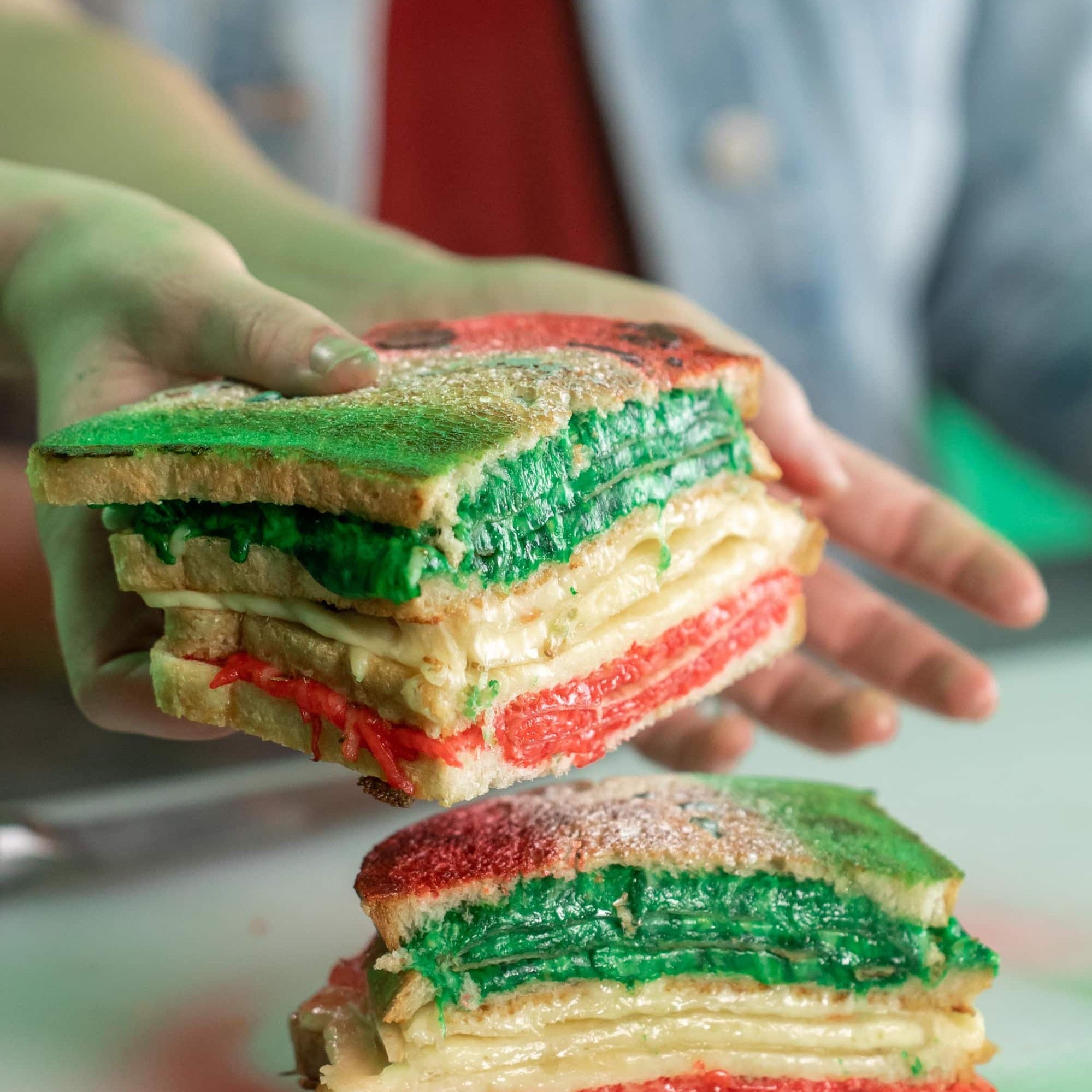 Cinco de Mayo themed quesadilla-sandwich stack into slices and served with guacamole and salsa.