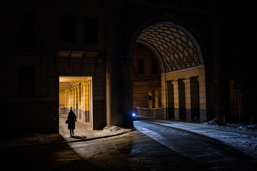 A woman walks down a street in downtown Kyiv on December 1, 2022, amid the Russian invasion of Ukraine.