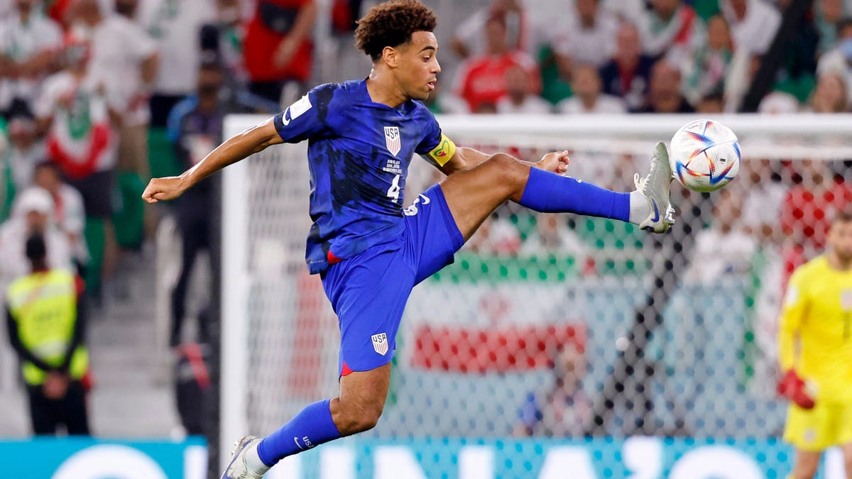 USMNT caption Tyler Adams kicks the ball against Iran during the second half of Tuesday's game.