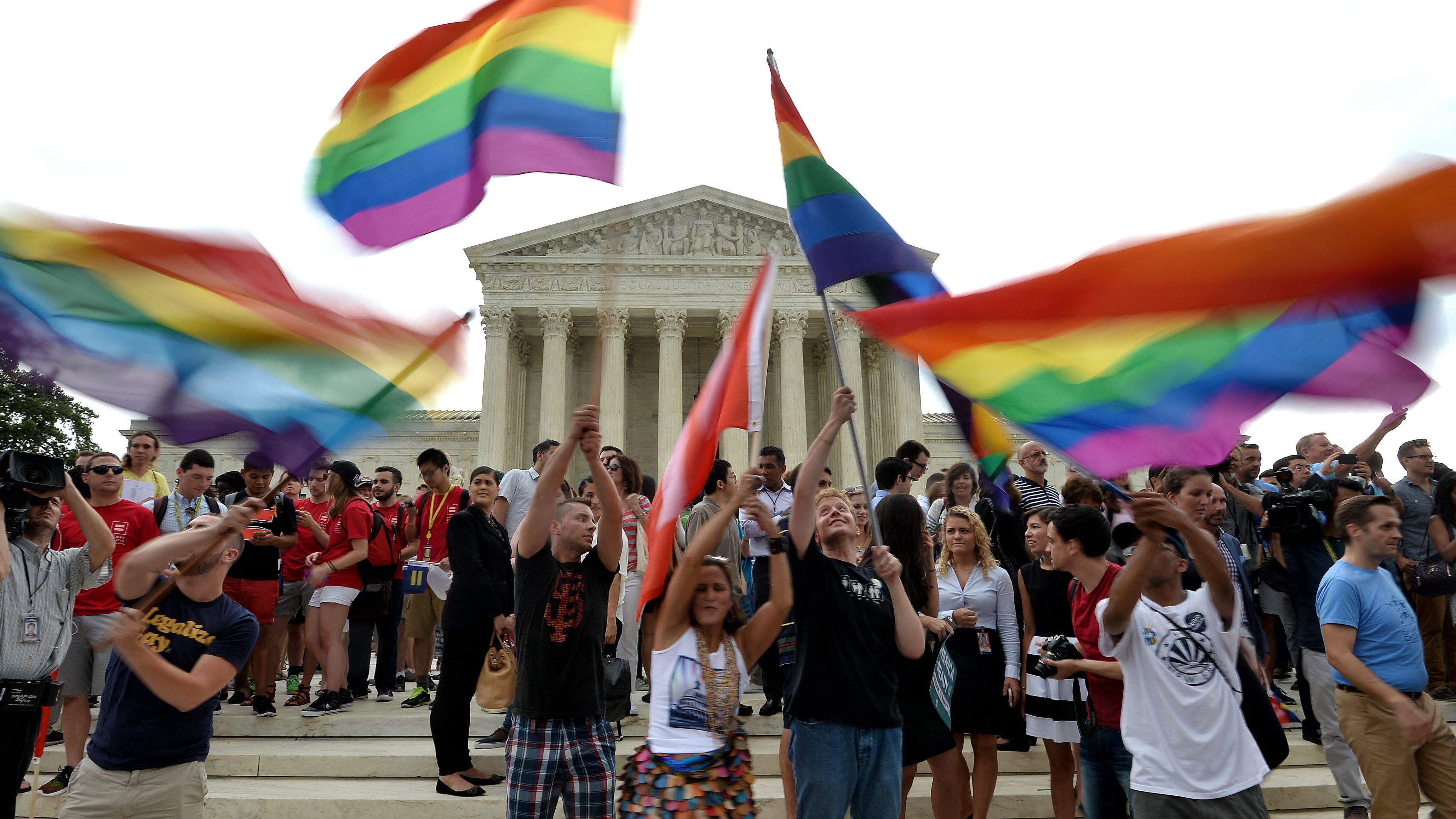 In this record  photograph  taken from June 26, 2015, radical   observe  extracurricular  the Supreme Court aft  the tribunal  legalized same-sex marriage.