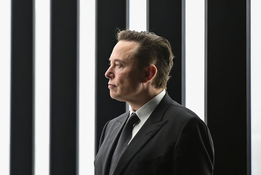 FILE - Elon Musk, Tesla CEO, attends the opening of the Tesla factory Berlin Brandenburg in Gruenheide, Germany, March 22, 2022. Musk said during a presentation Wednesday, Dec. 1, 2022, that his Neuralink company is seeking permission to test its brain implant in people soon. Musk's Neuralink is one of many groups working on linking brains to computers, efforts aimed at helping treat brain disorders, overcoming brain injuries and other applications. (Patrick Pleul/Pool via AP, File) ORG XMIT: NYAB422