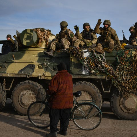 Ukrainian military vehicle pass by the village of 