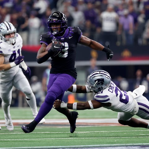 TCU wide receiver Savion Williams (18) runs with t