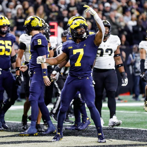 Michigan running back Donovan Edwards celebrates a