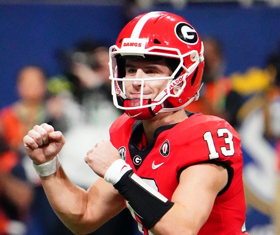 Georgia quarterback Stetson Bennett IV celebratesa touchdown against LSU.