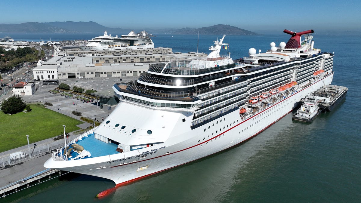 In an aerial view, the Carnival Miracle cruise ship operated by Carnival Cruise Lines sits docked at Pier 27 on September 30, 2022 in San Francisco, California.