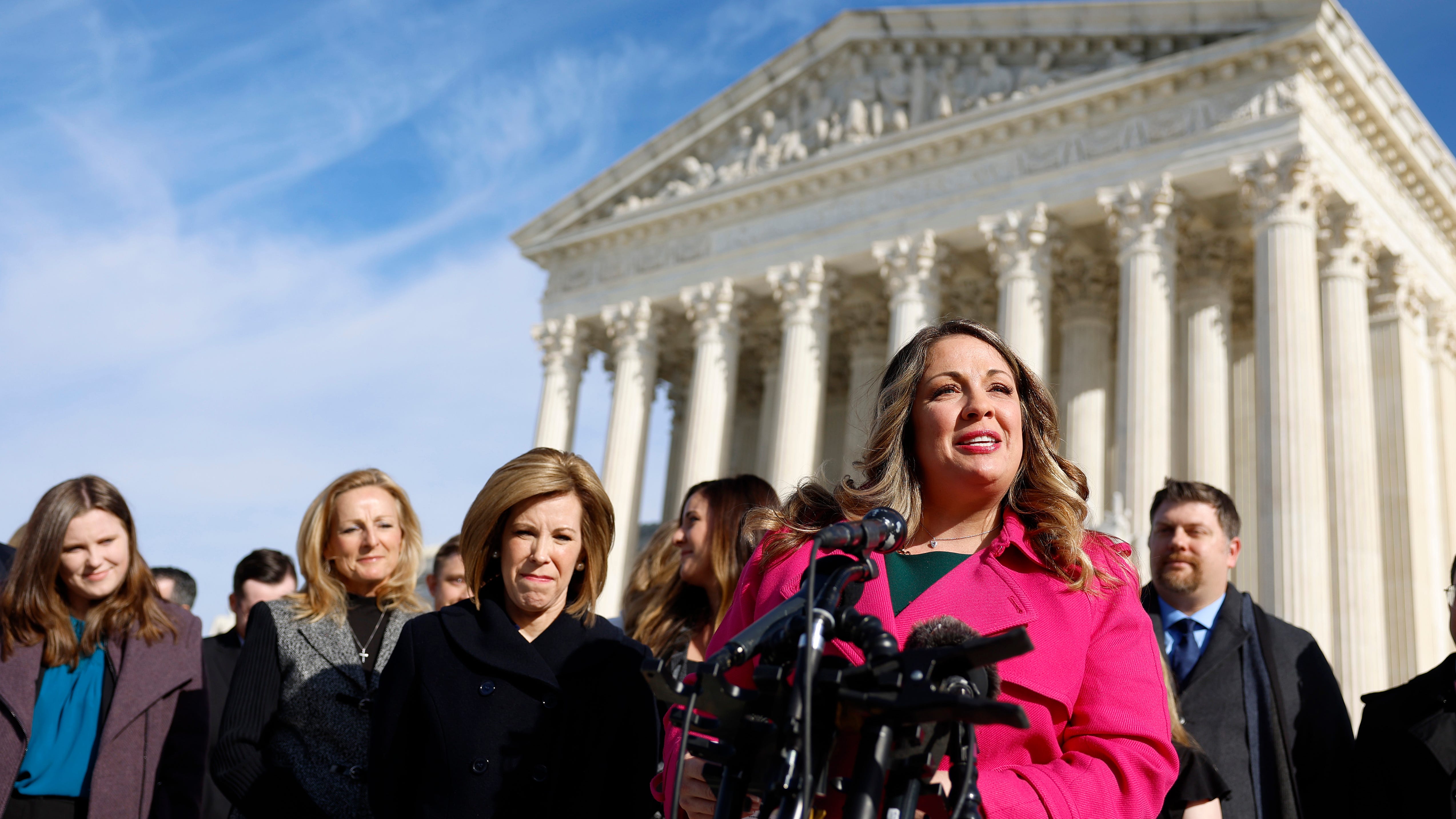 Lorie Smith, the owner of 303 Creative, speaks to reporters outside the U.S. Supreme Court on Dec. 05, 2022.