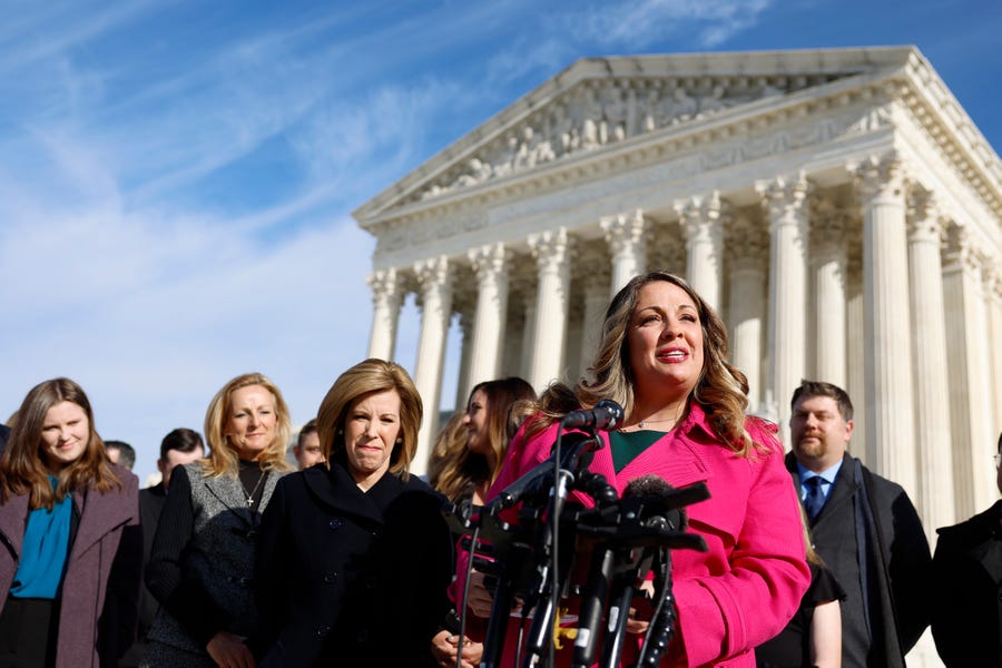 Lorie Smith, the owner of 303 Creative, a website design company in Colorado, speaks to reporters outside of the U.S. Supreme Court Building on December 05, 2022 in Washington, DC.