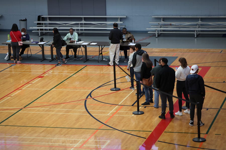 NORCROSS, GEORGIA - DECEMBER 06: Georgia voters cast their ballots in today's runoff election at the Lucky Shoals Park Recreation Center on December 06, 2022 in Norcross, Georgia. Georgia Democratic Senate candidate U.S. Sen. Raphael Warnock (D-GA)  faces off today against his Republican challenger Herschel Walker.