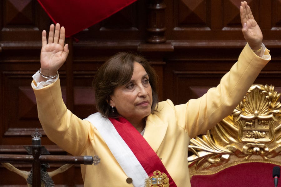 Peruvian Dina Boluarte greets members of the Congress after being sworn in as the new President hours after former President Pedro Castillo was impeached in Lima, on December 7, 2022. Peru's Pedro Castillo was impeached and replaced as president by his deputy on Wednesday in a dizzying series of events.