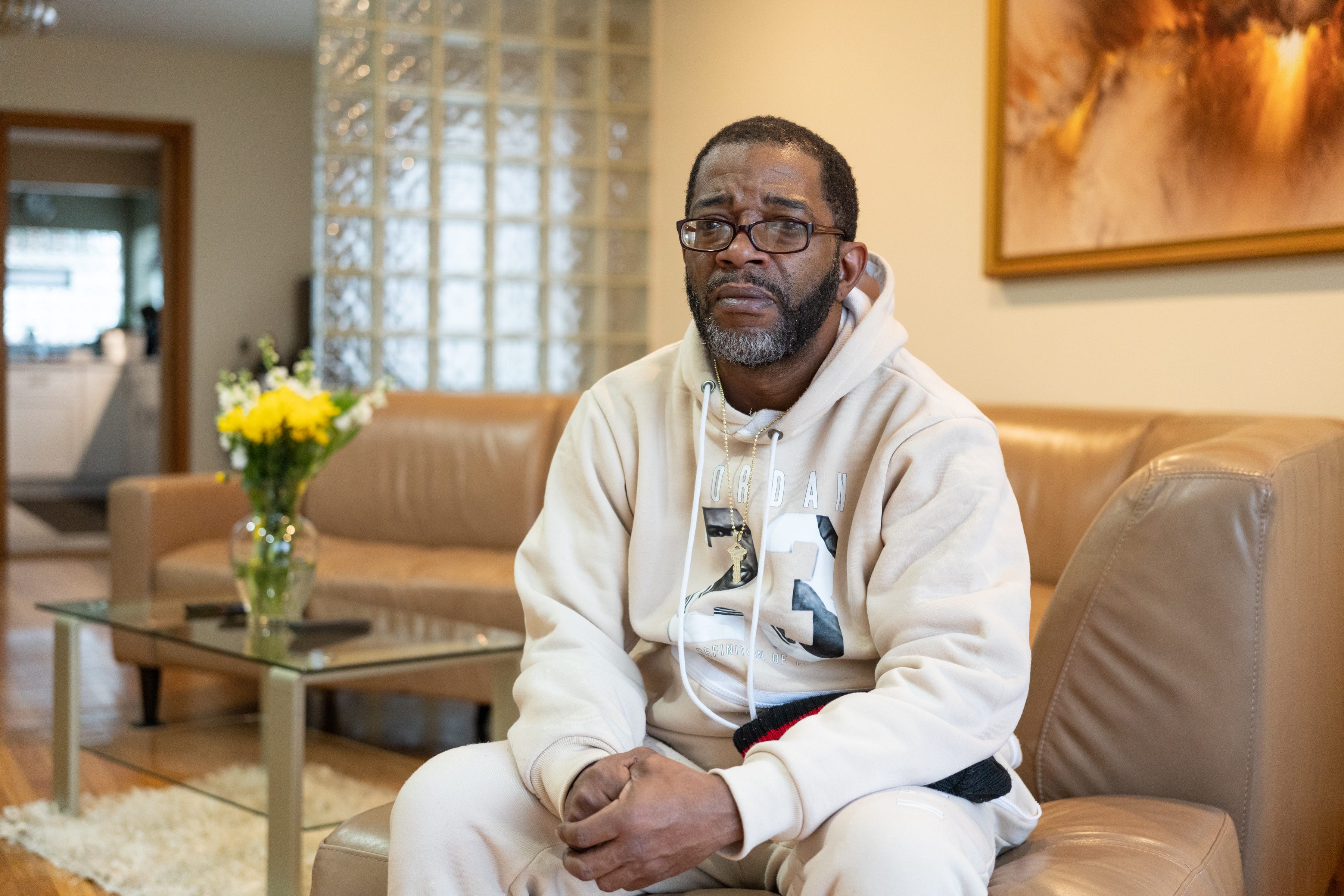 Derrick Mapp, 49, sits at his mother’s home in the Calumet Heights neighborhood of Chicago on Dec. 11, 2022.