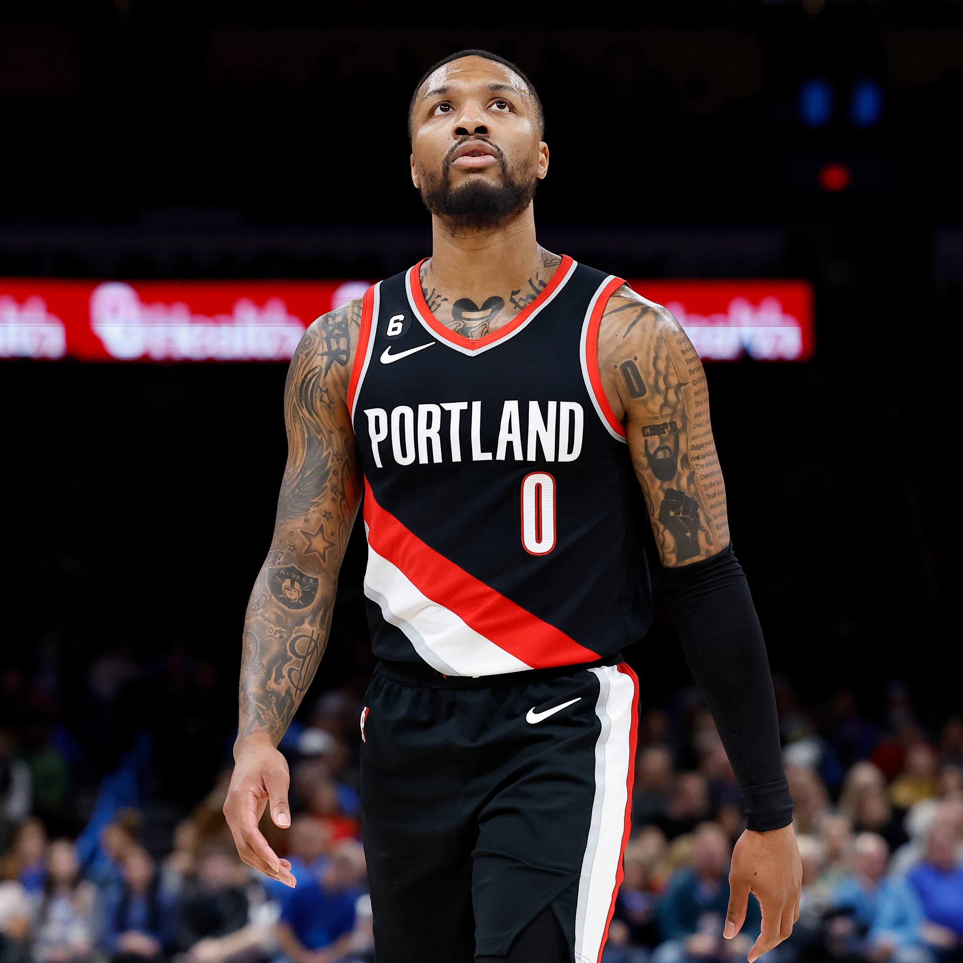 Dec 19, 2022; Oklahoma City, Oklahoma, USA; Portland Trail Blazers guard Damian Lillard (0) looks at the score board during a time out against the Oklahoma City Thunder in the first quarter at Paycom Center. Mandatory Credit: Alonzo Adams-USA TODAY Sports