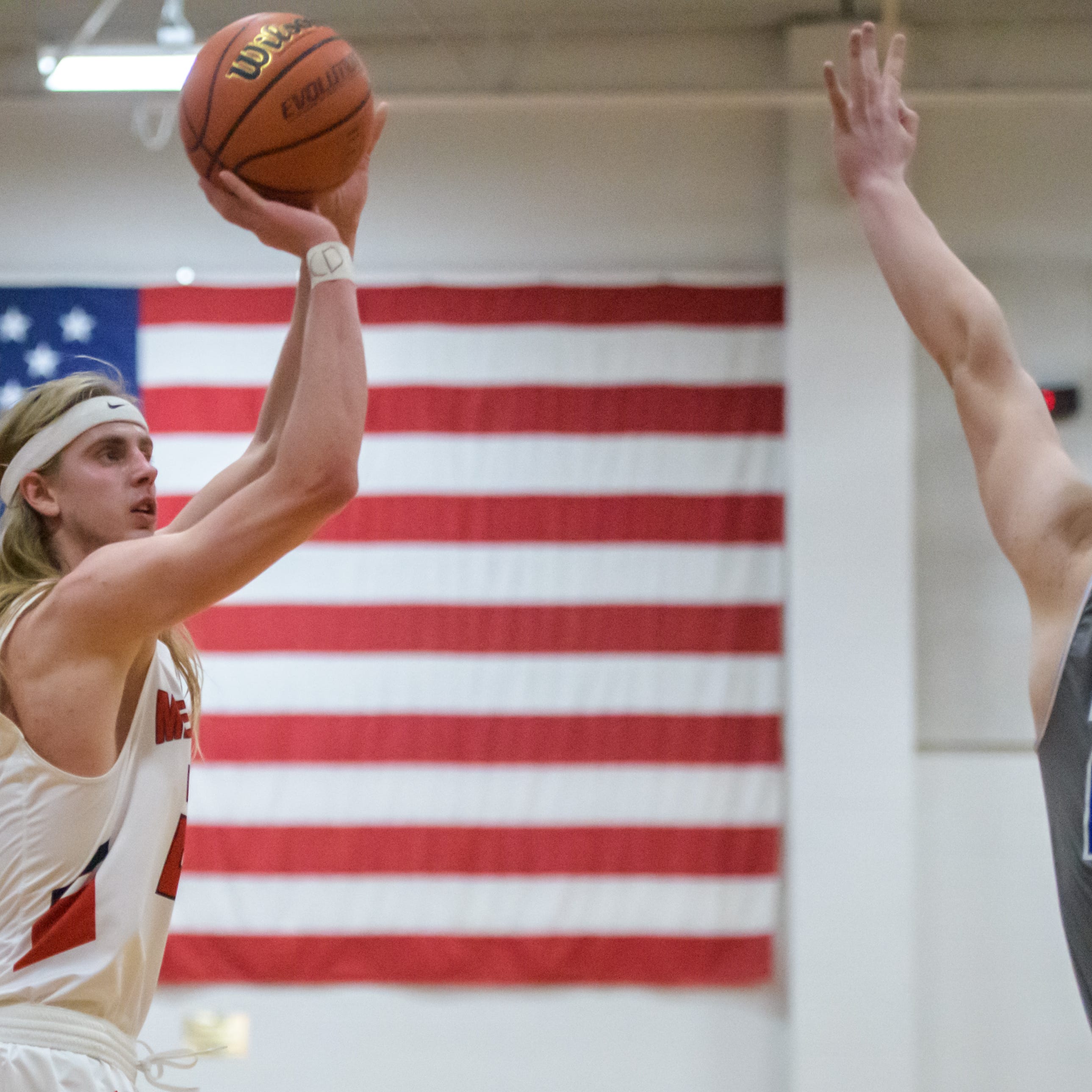 Metamora's Ethan Kizer, left, shoots over Limestone's Dylan Bitner in the second half Tuesday, Dec. 20, 2022 in Metamora. The Redbirds defeated the Rockets 76-45.