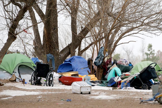 A homeless camp is seen west of downtown Oklahoma City during a winter storm, Thursday, Dec. 22, 2022. 