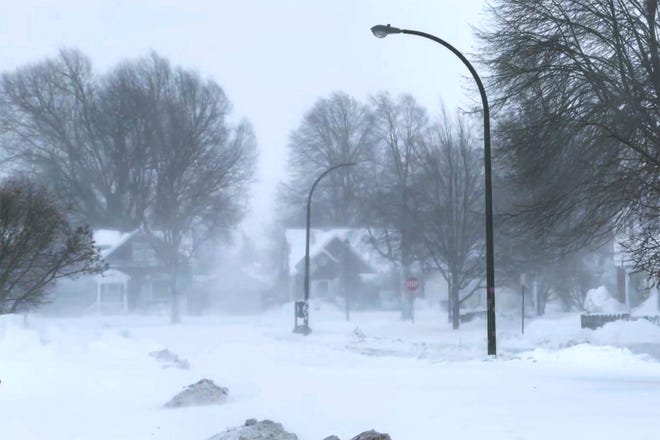 The high wind blows the snow across a neighborhood in Buffalo, N.Y., on Saturday, Dec. 24, 2022 in Buffalo, N.Y.