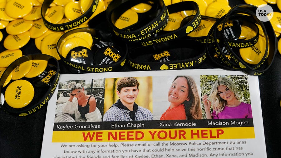 A flyer seeking information about the killings of four University of Idaho students who were found dead on Nov. 13, 2022, is displayed on a table along with buttons and bracelets, Wednesday, Nov. 30, 2022, during a vigil in memory of the victims in Moscow, Idaho.