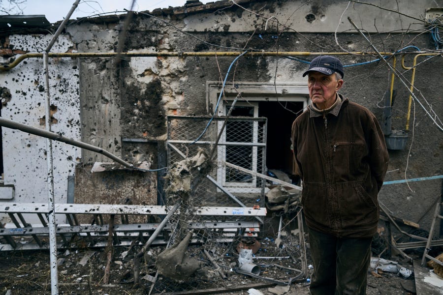 A resident looks at his destroyed house after Russian shelling in Kherson, Ukraine, Thursday, Jan. 5, 2023.