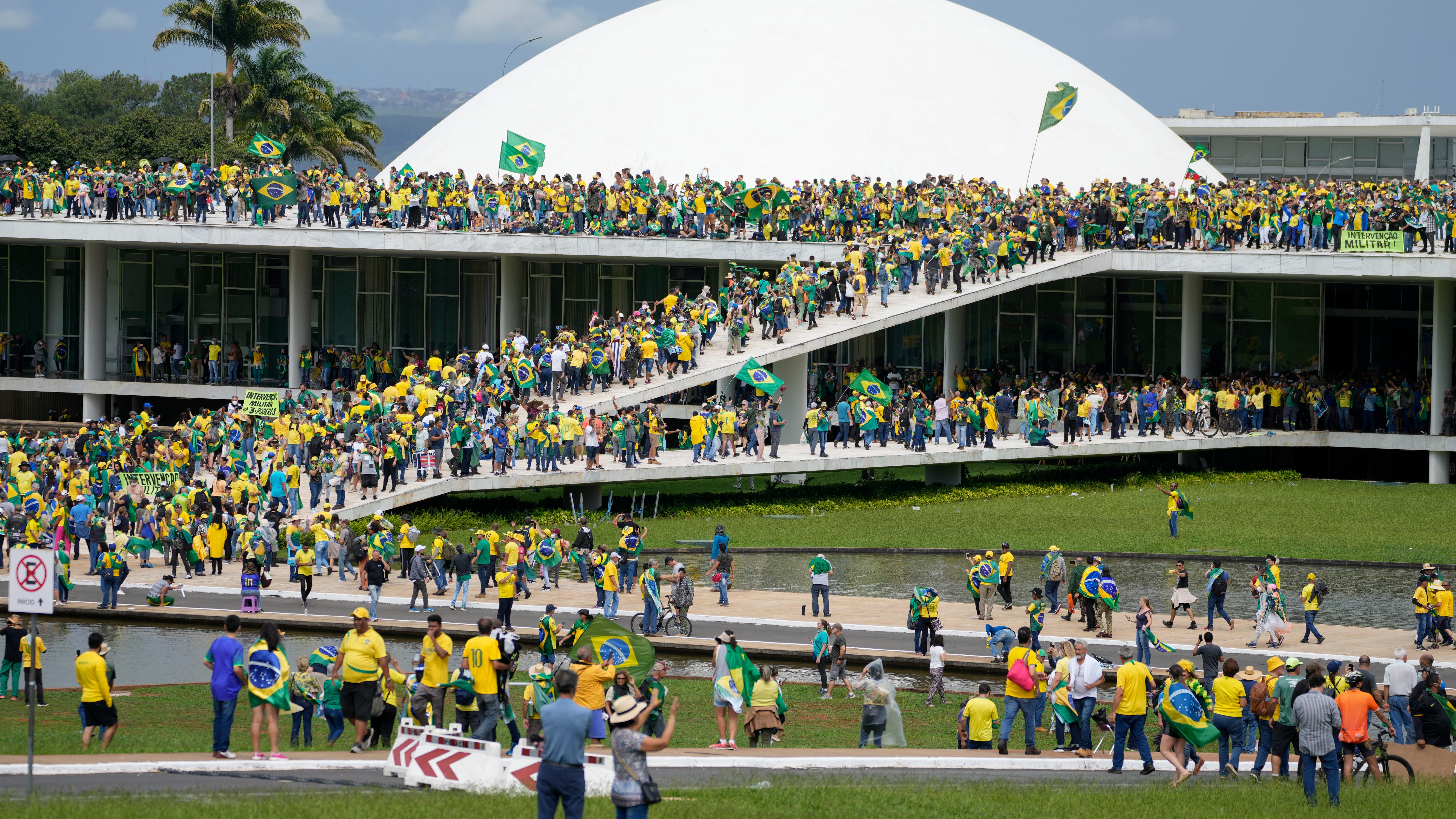 Protesters, supporters of Brazil's former President Jair Bolsonaro, storm the the National Congress building in Brasilia, Brazil, Sunday, Jan. 8, 2023. 