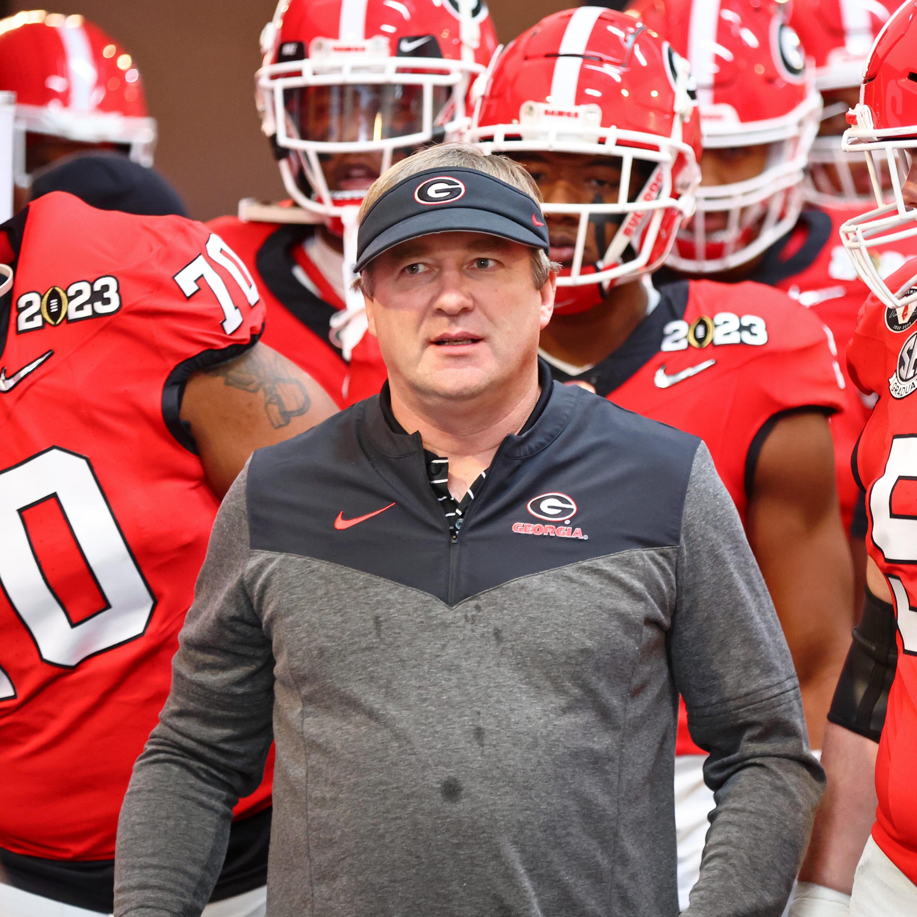 Georgia coach Kirby Smart leads his team onto the field during warmups before their College Football Playoff championship game matchup against TCU at SoFi Stadium.