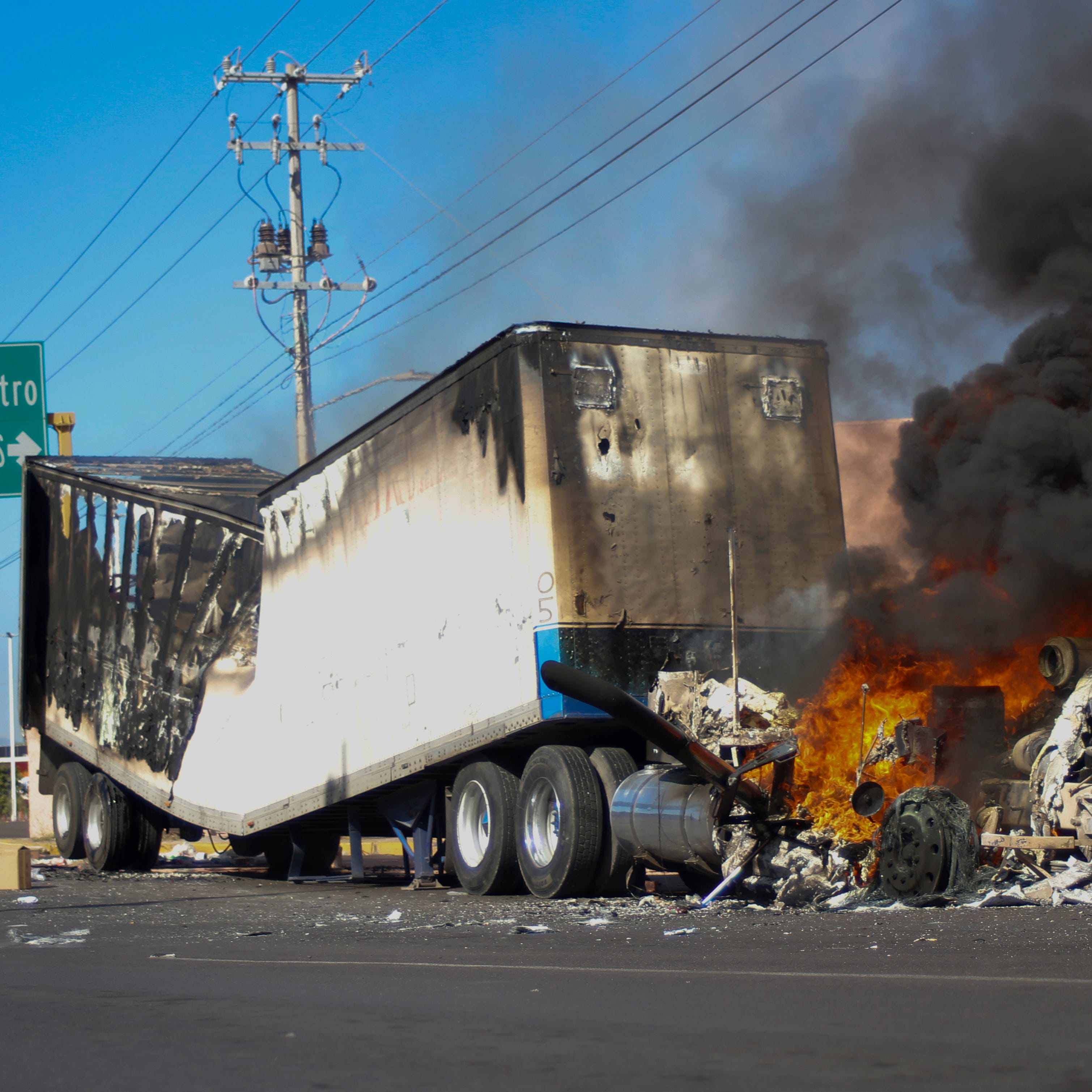 A truck burns on a street in Culiacán, Sinaloa state, Thursday, Jan. 5, 2023. Mexican security forces captured Ovidio Guzmán, an alleged drug trafficker wanted by the United States and one of the sons of former Sinaloa Cartel boss Joaquín 