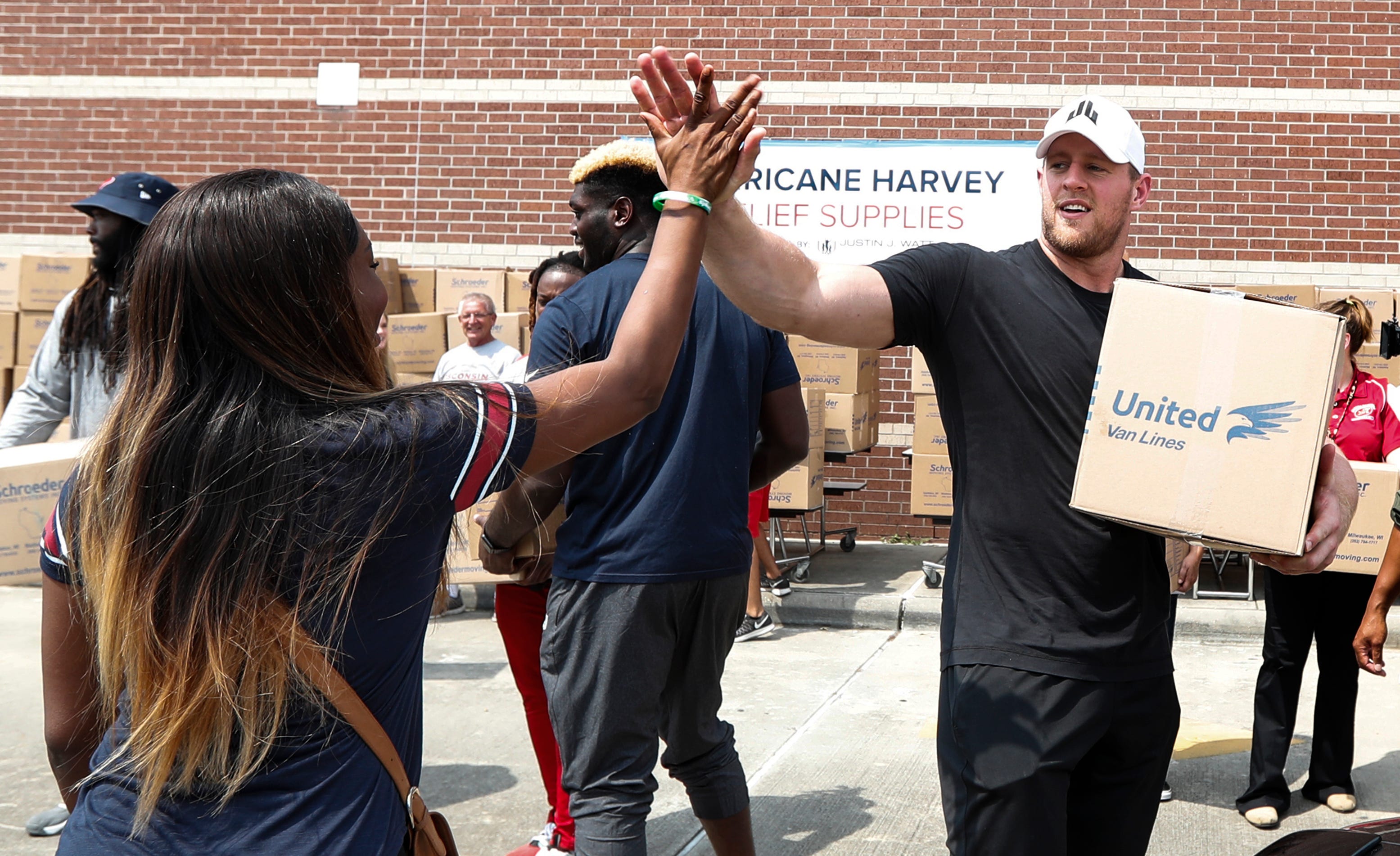 LOS ANGELES RAMS DEFENSIVE LINEMAN ROBERT YOUNG STOPS HARVEY