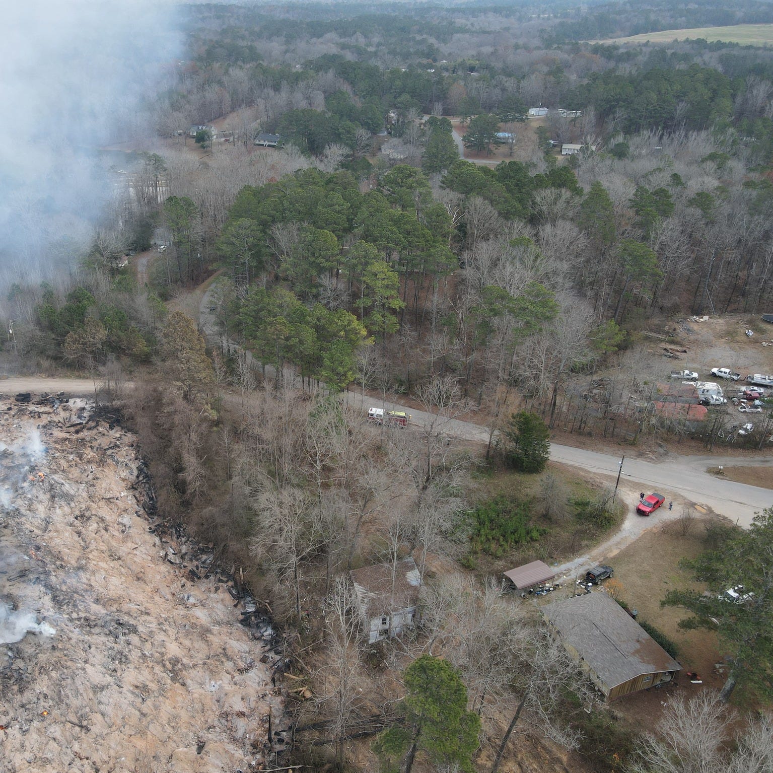 Fire burns beneath a landfill in St. Clair County, Alabama, in a photo released by Moody Fire Department on Dec. 19, 2022.