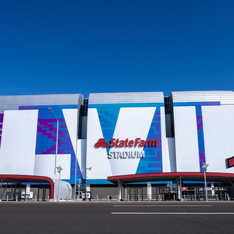 The front of State Farm Stadium is covered in a Su