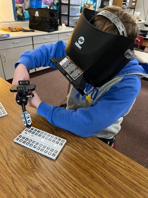 Students at Oconto Middle School use a virtual welder to master techniques without the risk of electric shock, burns, eye injuries, or infrared exposure.