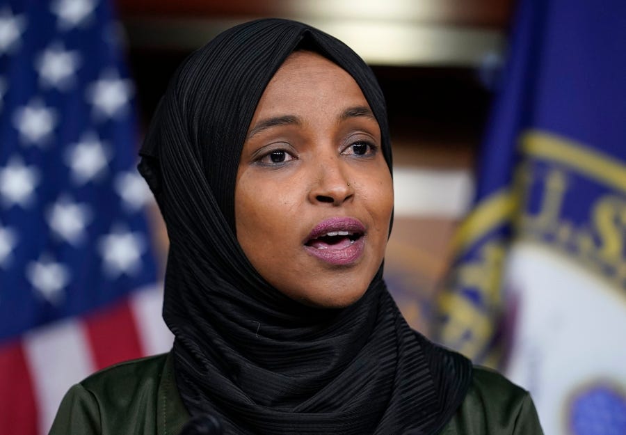 FILE - Rep. Ilhan Omar, D-Minn., speaks to reporters during a news conference at the Capitol in Washington, Nov. 30, 2021. Progressive and centrist Democrats in the House have clinched agreement on a long-sought policing and public safety package that will be brought to the House floor just weeks before the midterm elections. The breakthrough came after intense negotiations in recent days between Rep. Josh Gottheimer, D-N.J., a leader of the centrist coalition, and Omar, one of the leaders of the   progressive faction. (AP Photo/J. Scott Applewhite, File)