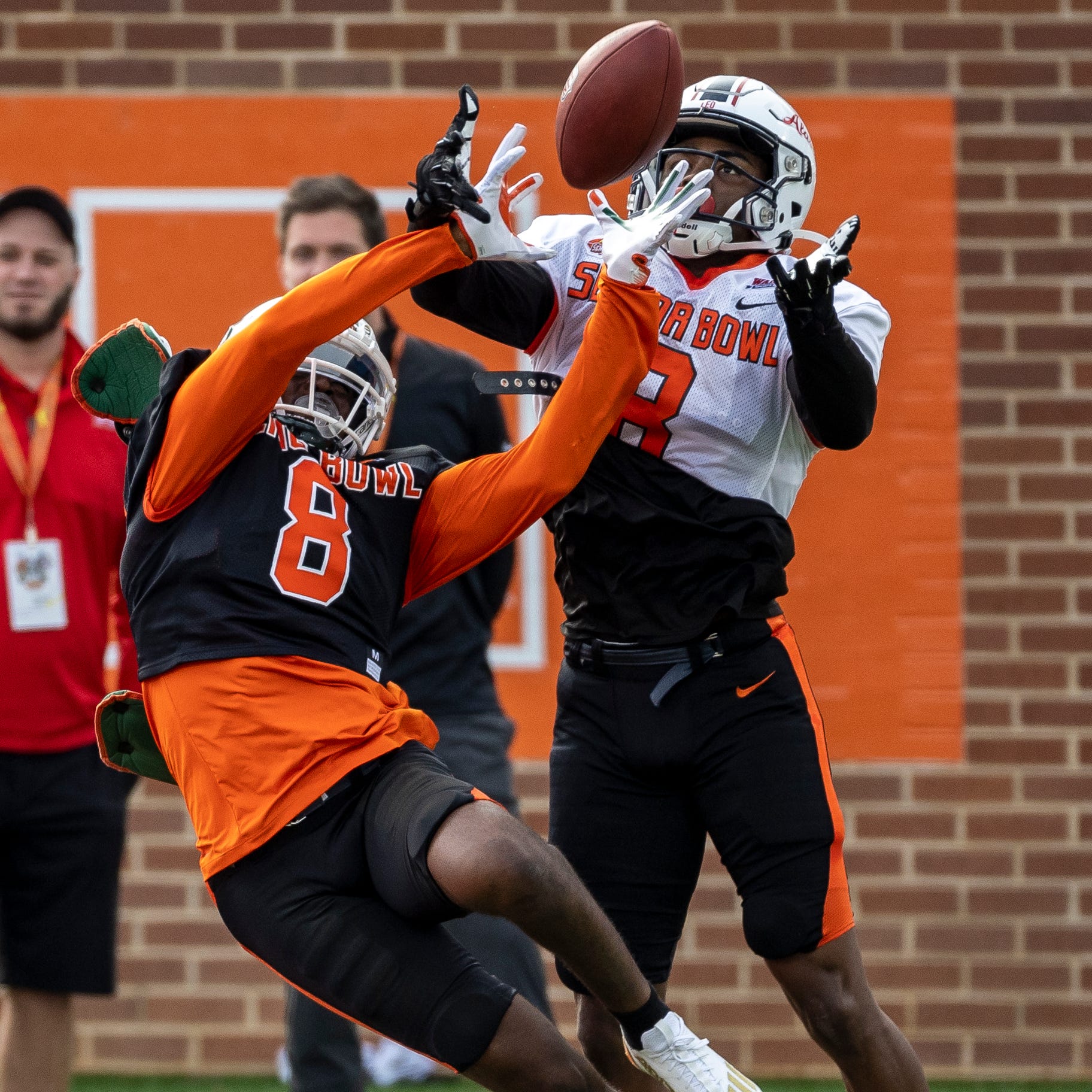 Defensive back Tyrique Stevenson of Miami (8) and wide receiver Jalen Wayne of South Alabama (8) track a pass.