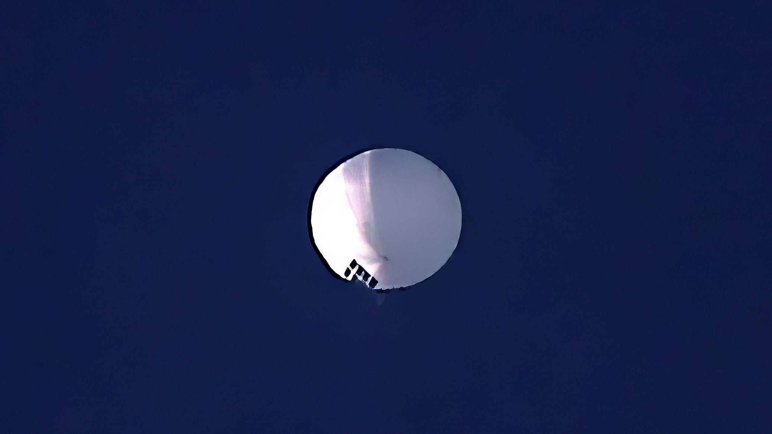 A high altitude balloon floats over Billings, Mont., on Wednesday, Feb. 1, 2023. The Pentagon would not confirm that the balloon in the photo was the surveillance balloon. (Larry Mayer/The Billings Gazette via AP)