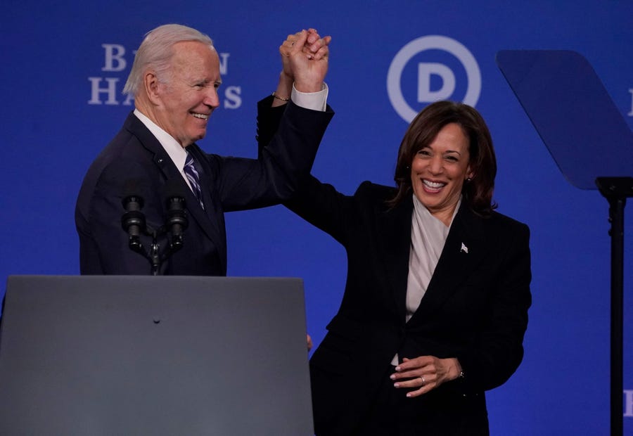 US Vice President Kamala Harris and US President Joe Biden hold hands at the Democratic National Committee (DNC) 2023 Winter meeting in Philadelphia, Pennsylvania, on February 3, 2023. - The DNC on February 4, 2023, is expected to approve a new lineup for the partys presidential primaries.