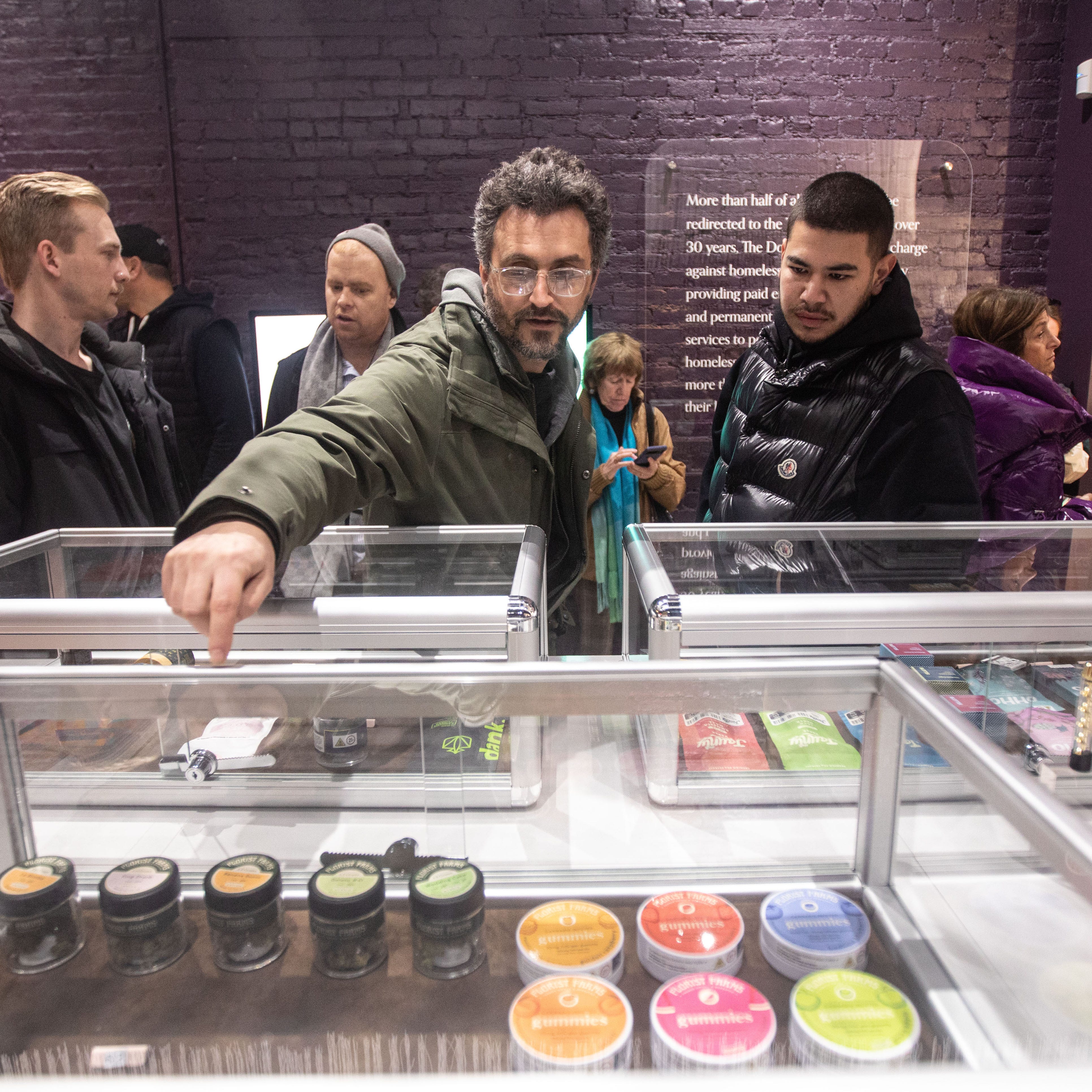 Customers browse products for sale at Union Square Travel Agency: A Cannabis Store located on 13th St. in Manhattan Feb. 13, 2023. The cannabis dispensary is the third to open in Manhattan in recent weeks, and the fourth to open in New York State.