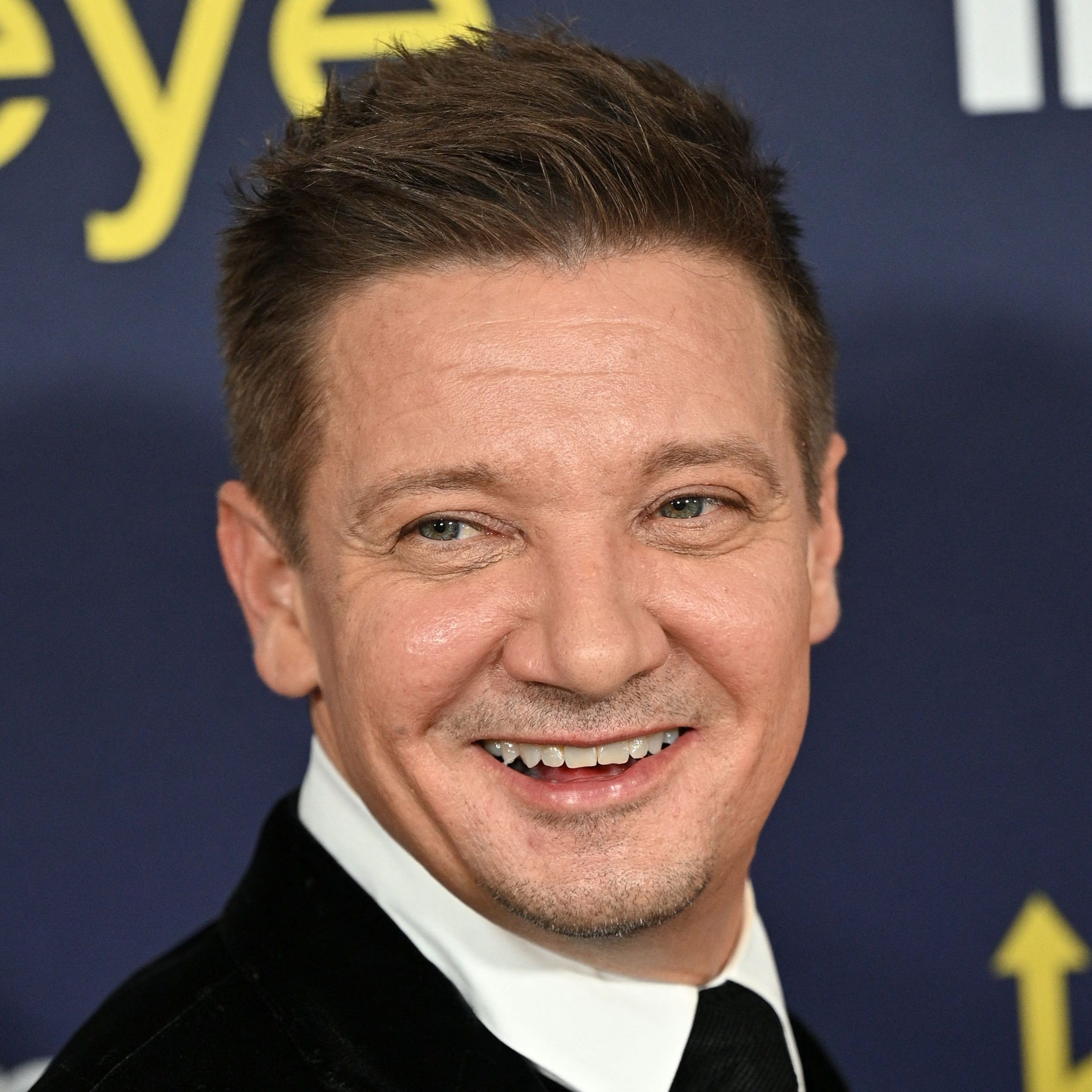 (FILES) In this file photo taken on November 17, 2021 US actor Jeremy Renner arrives for the premiere of Marvel Studios' television miniseries "Hawkeye" at the El Capitan Theatre in Los Angeles. - Movie star Jeremy Renner, known for his role as Hawkeye in several Marvel blockbusters, was in critical but stable condition following an accident while plowing snow, his representative told US media. Renner was using a truck-sized tracked snow vehicle about a quarter mile from his mountain home on January 1, 2023 when   the vehicle accidentally ran over one of his legs, the TMZ tabloid news website said. (Photo by Robyn Beck / AFP) (Photo by ROBYN BECK/AFP via Getty Images) ORIG FILE ID: AFP_336E7FA.jpg