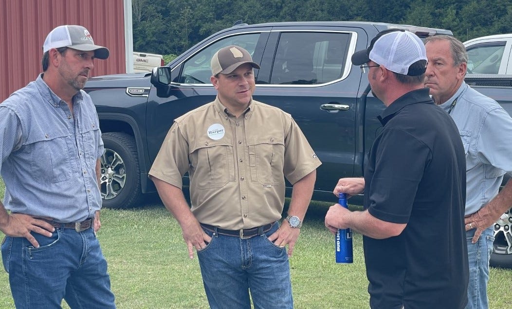 Georgia Agriculture Commissioner Tyler Harper (center) talks with farmers in Jefferson County during his campaign.