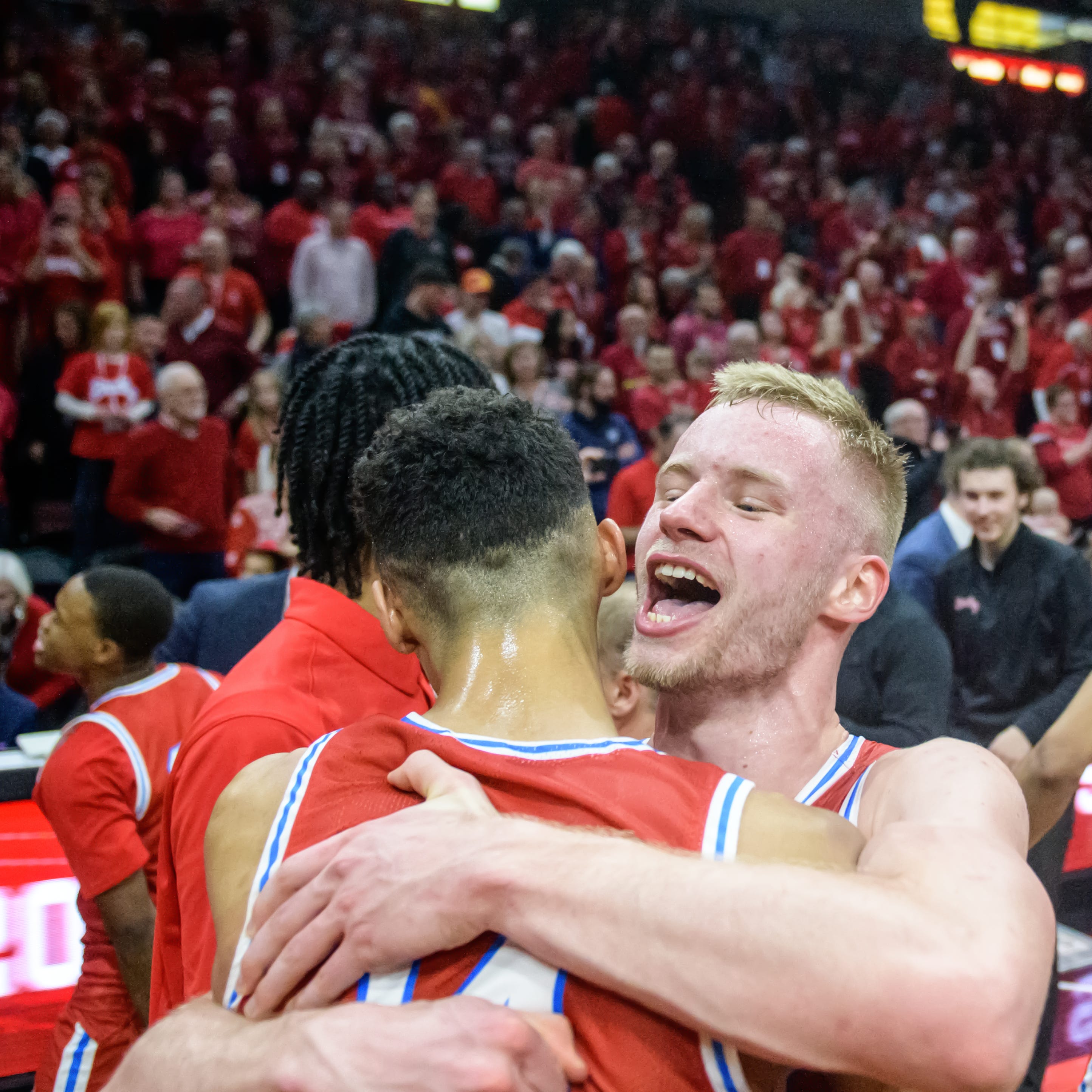 Bradley's Rienk Mast, facing, celebrates with teammate Malevy Leons and a packed house after defeating Drake 73-61 for the MVC championship Sunday, Feb. 26, 2023 at Carver Arena.