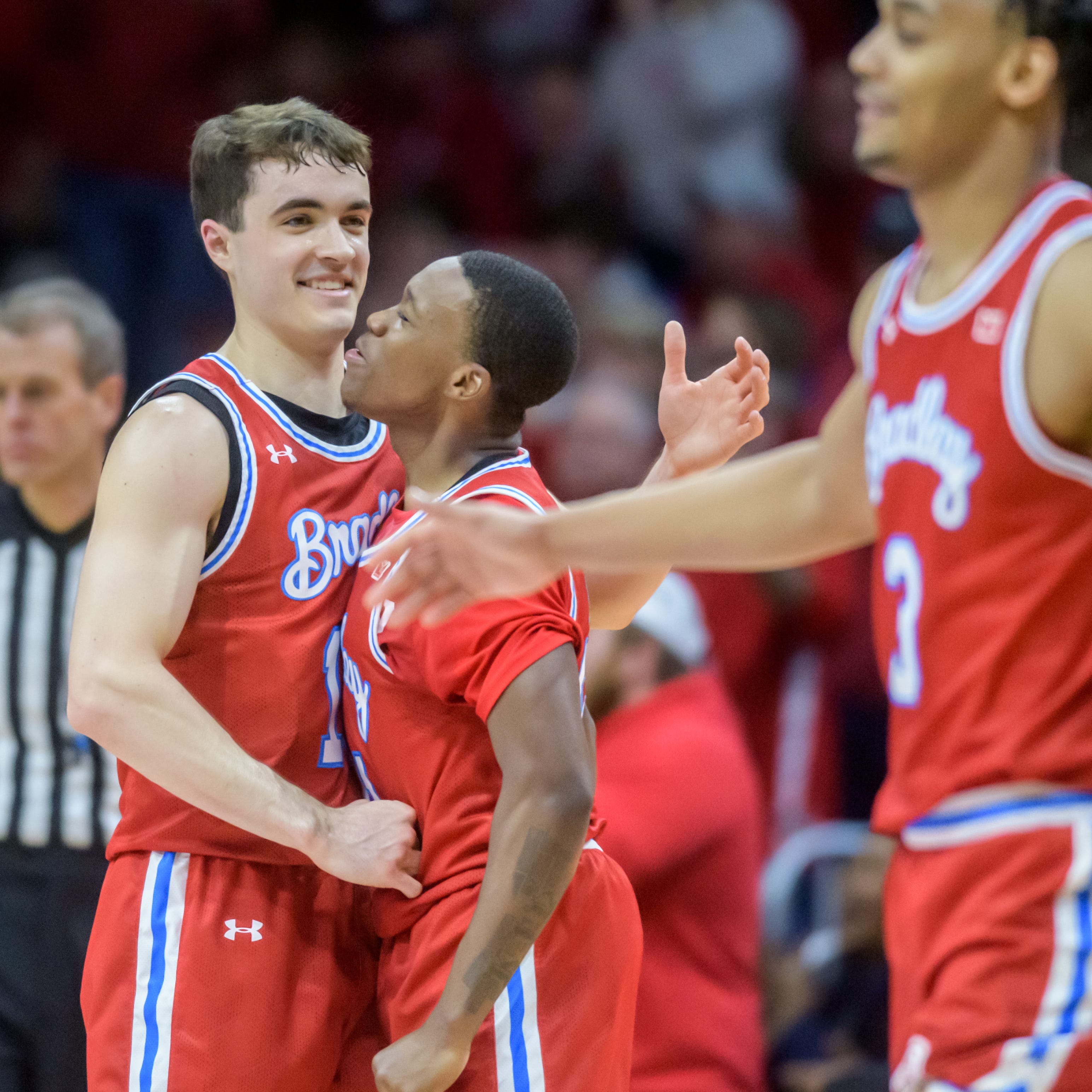 Bradley's Connor Hickman, left, and Duke Deen celebrate a Bradley score against Drake in the second half Sunday, Feb. 26, 2023 at Carver Arena. The Braves defeated the Bulldogs 73-61.