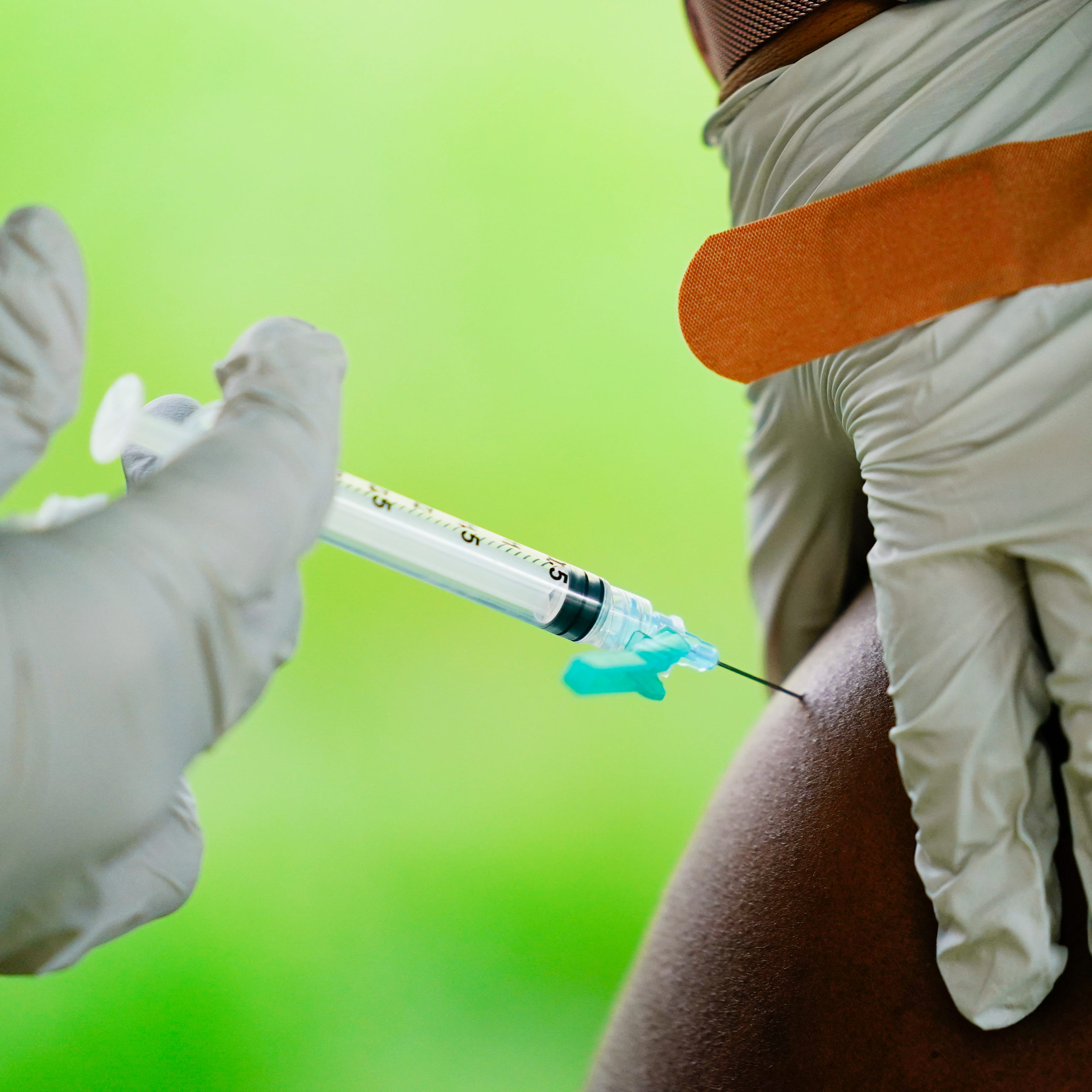 A health worker administers a dose of COVID-19 vaccine during a vaccination clinic in Reading, Pa. On Friday, Feb. 3, 2023.