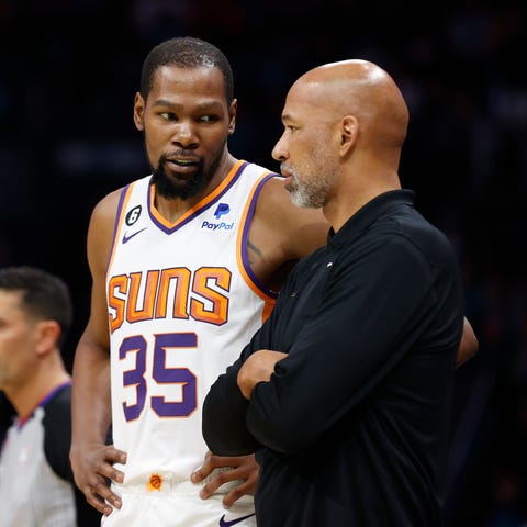 Phoenix Suns forward Kevin Durant speaks with head